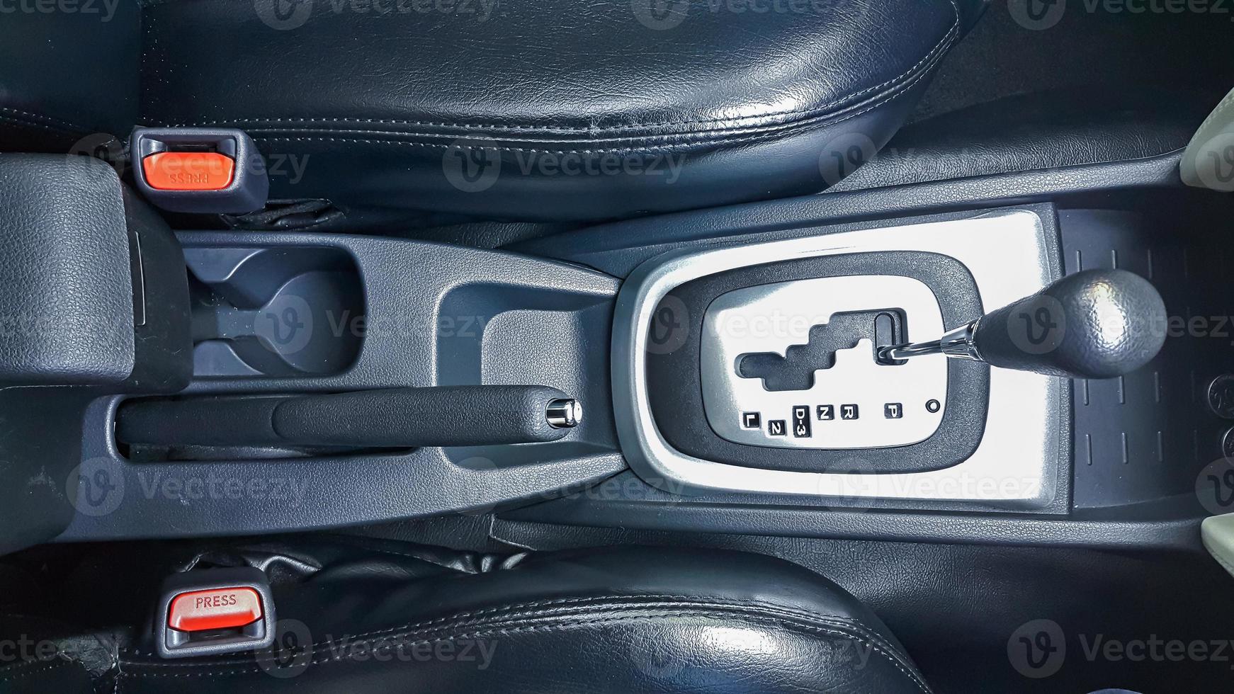 Car center console with automatic gearshift lever and parking brake photo