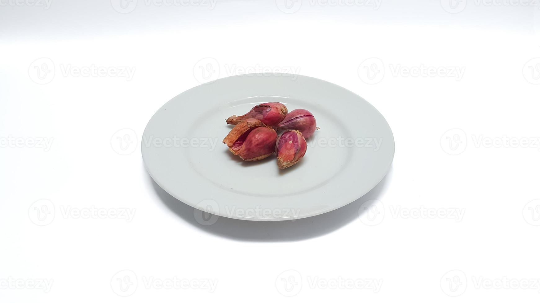 Shallot on white plate isolated on white background. photo