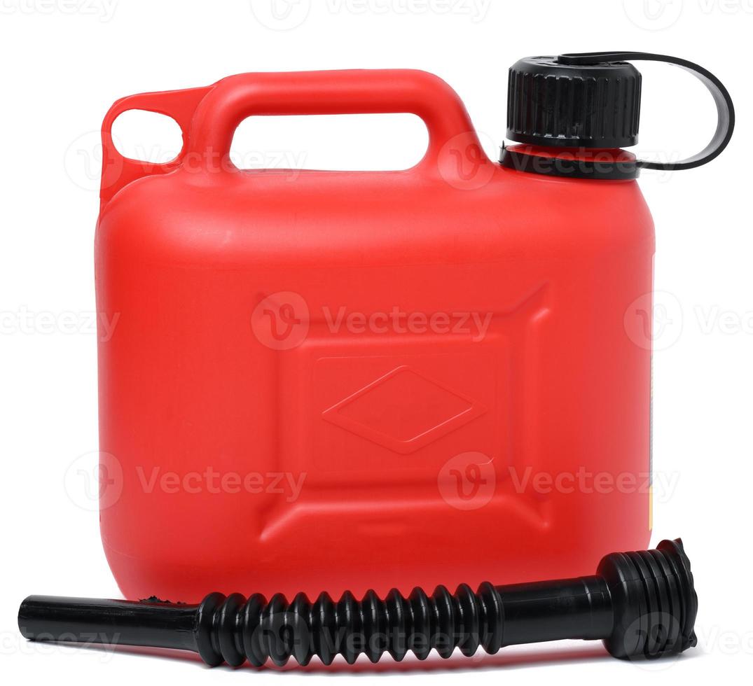 Red plastic canister for liquid fuels and lubricants on a white isolated background photo