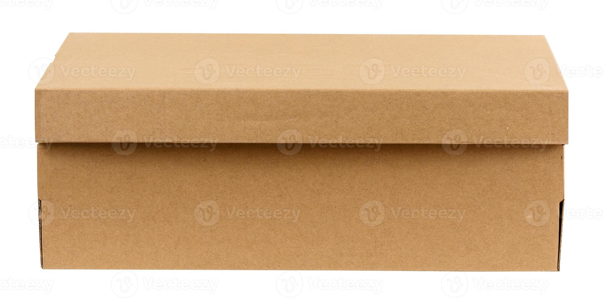 closed brown cardboard box for shoes isolated on white background. Storage box, transportation of goods photo