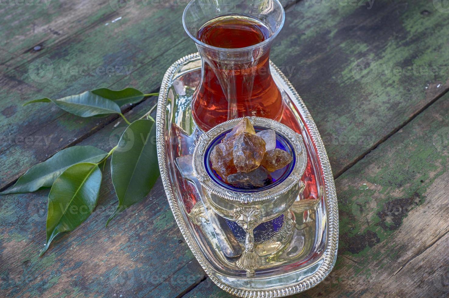 Black tea Turkish glass on a silver platter photo