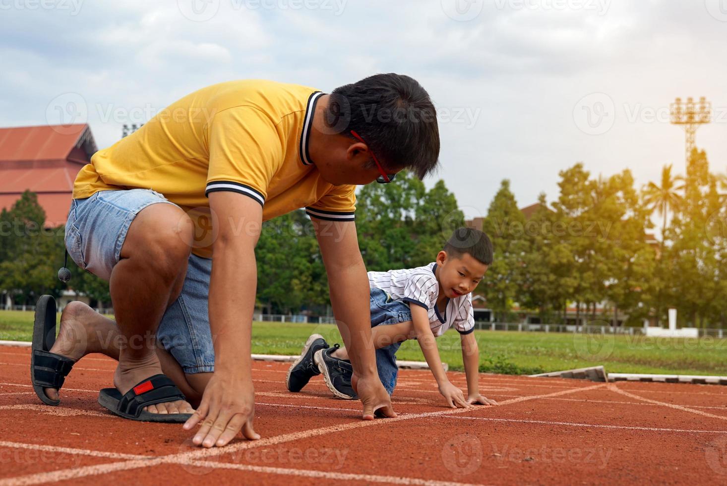 Father and son started running together on the treadmill. in the concept of outdoor play, family activities, outdoor activities. Soft and selective focus. photo