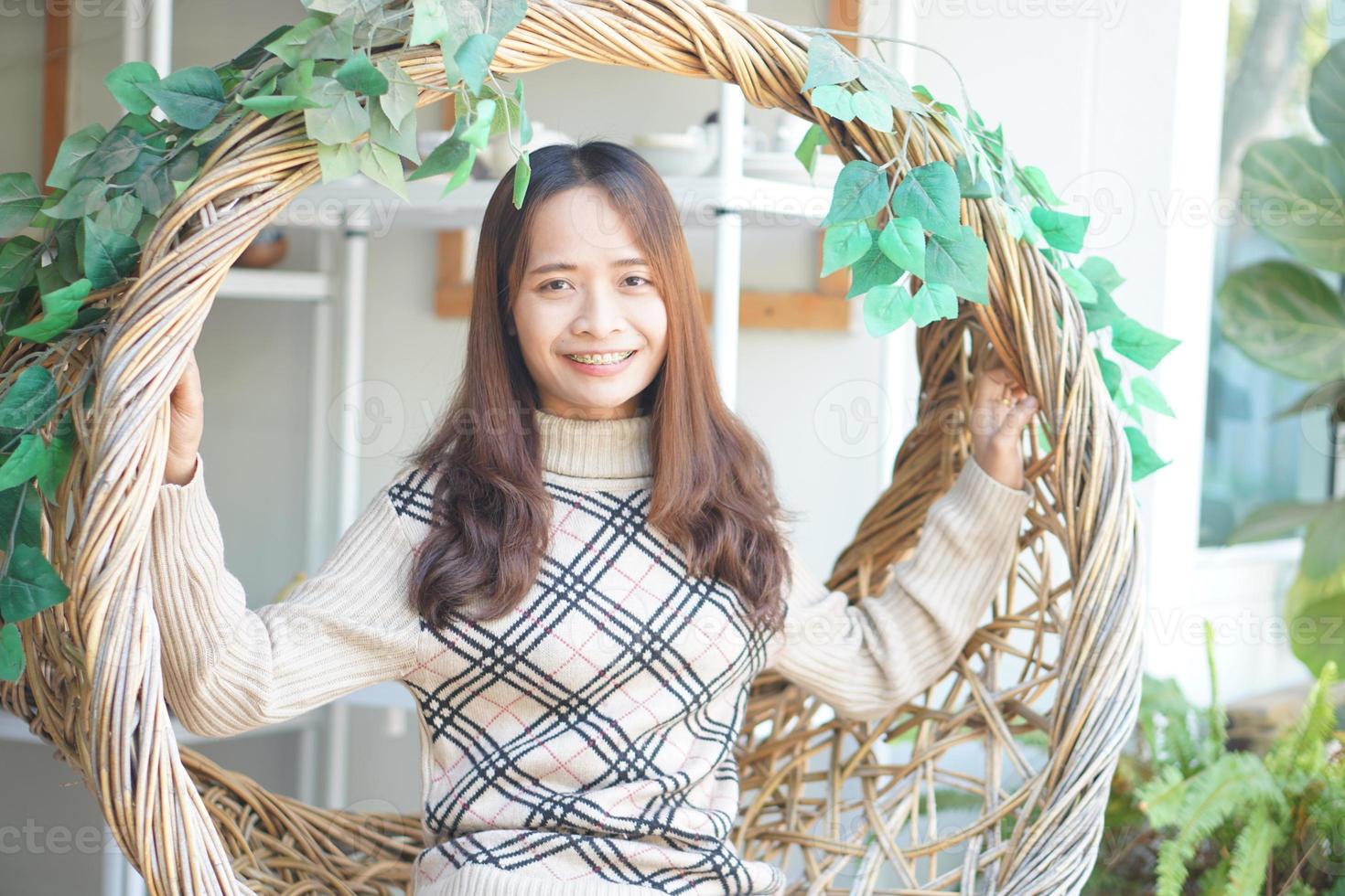 Happy Asian woman at the cafe on holiday photo