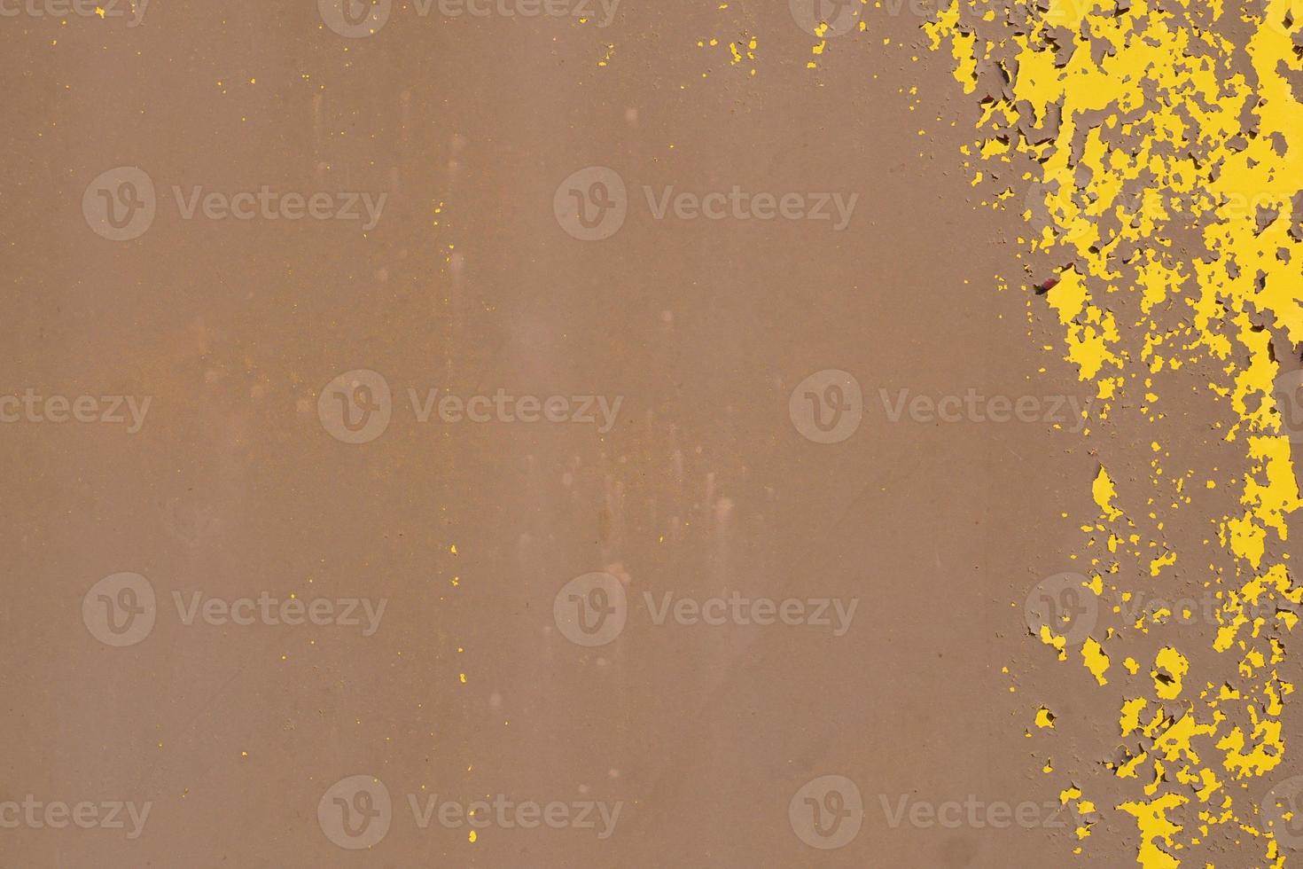 Yellow steel plate, rough surface, peeling paint, showing rusty steel texture. abstract background. photo