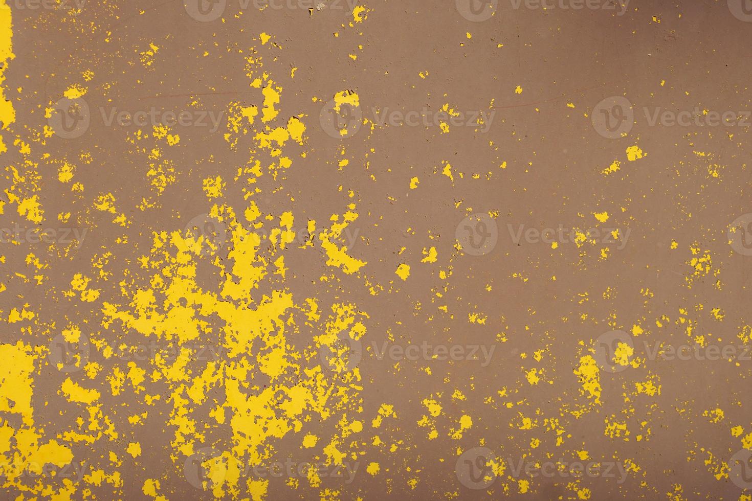 Yellow steel plate, rough surface, peeling paint, showing rusty steel texture. abstract background. photo