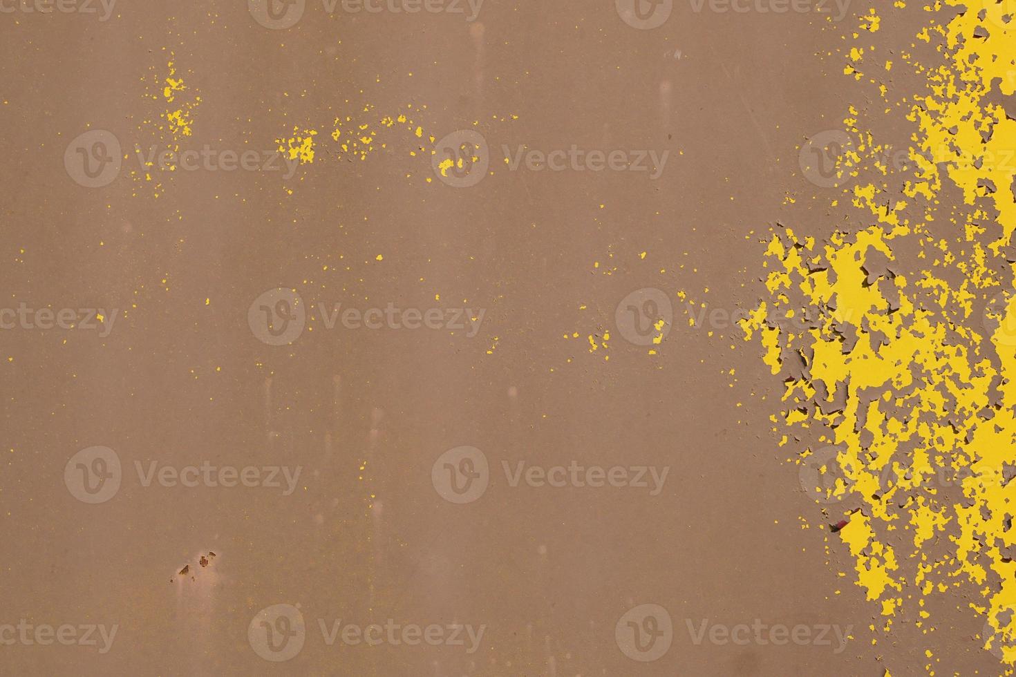 Yellow steel plate, rough surface, peeling paint, showing rusty steel texture. abstract background. photo