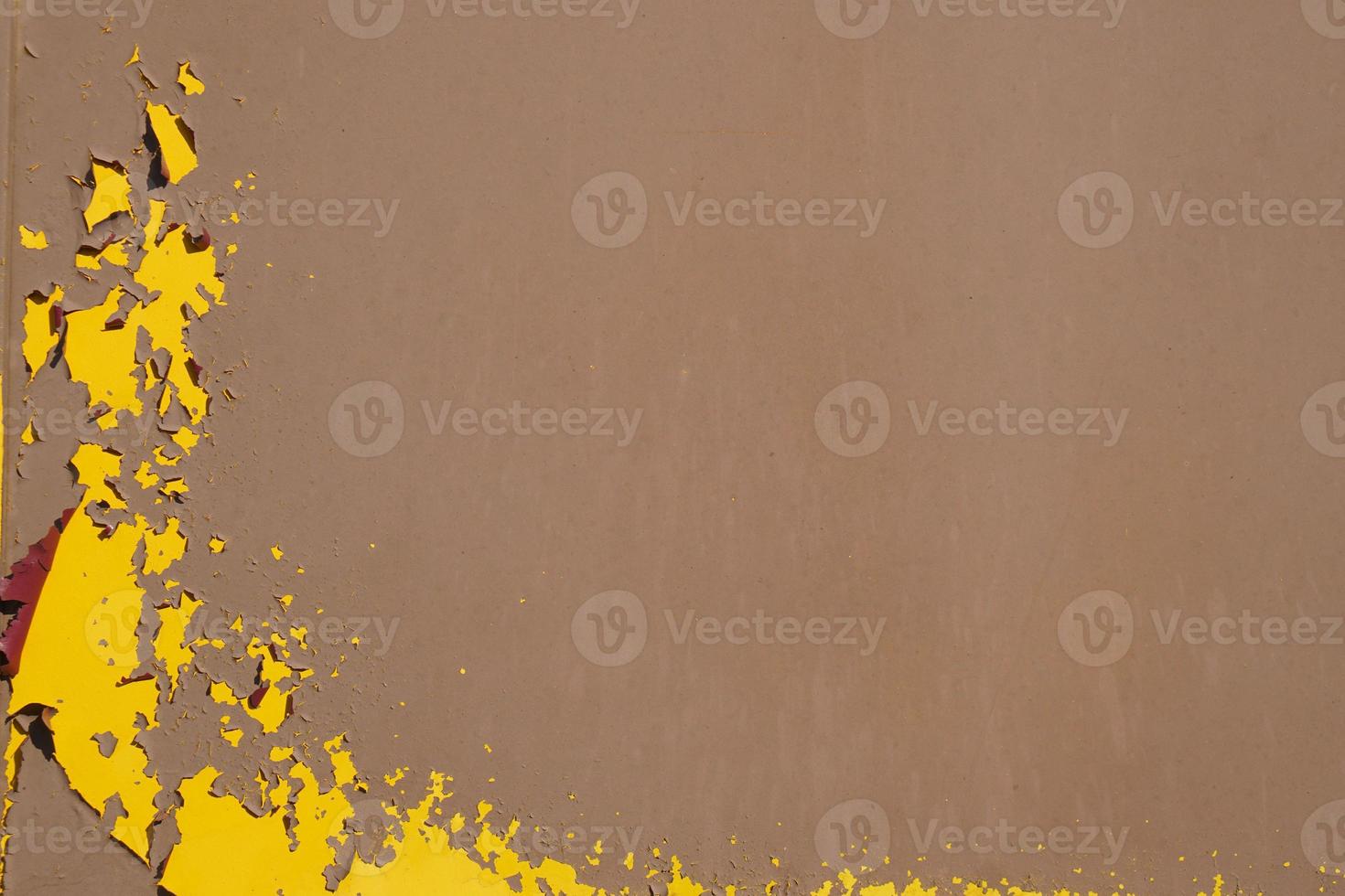 Yellow steel plate, rough surface, peeling paint, showing rusty steel texture. abstract background. photo