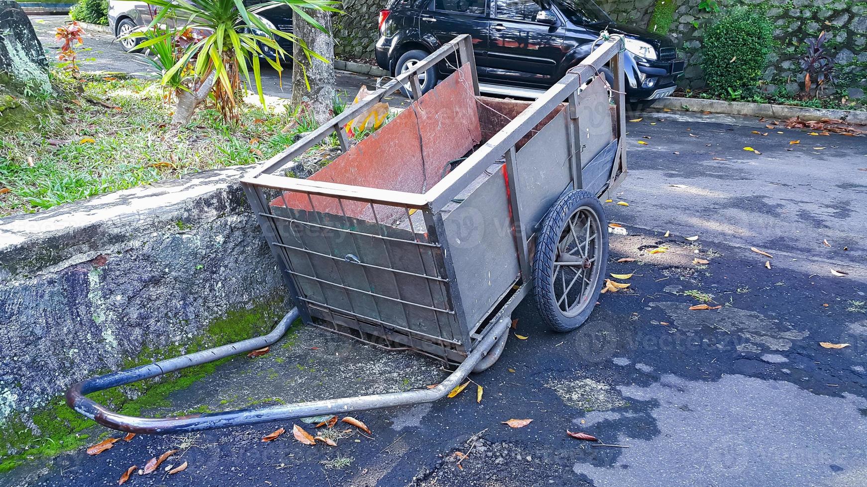 Gardening wheelbarrow for transportation of garbage. Outdoors. photo