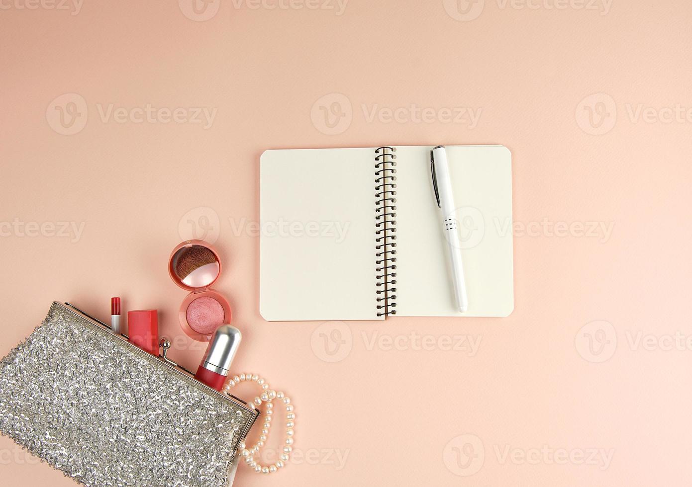 open notebook with clean white sheets and a pen photo