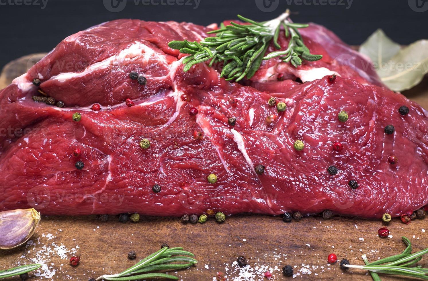 raw beef tenderloin with pepper photo