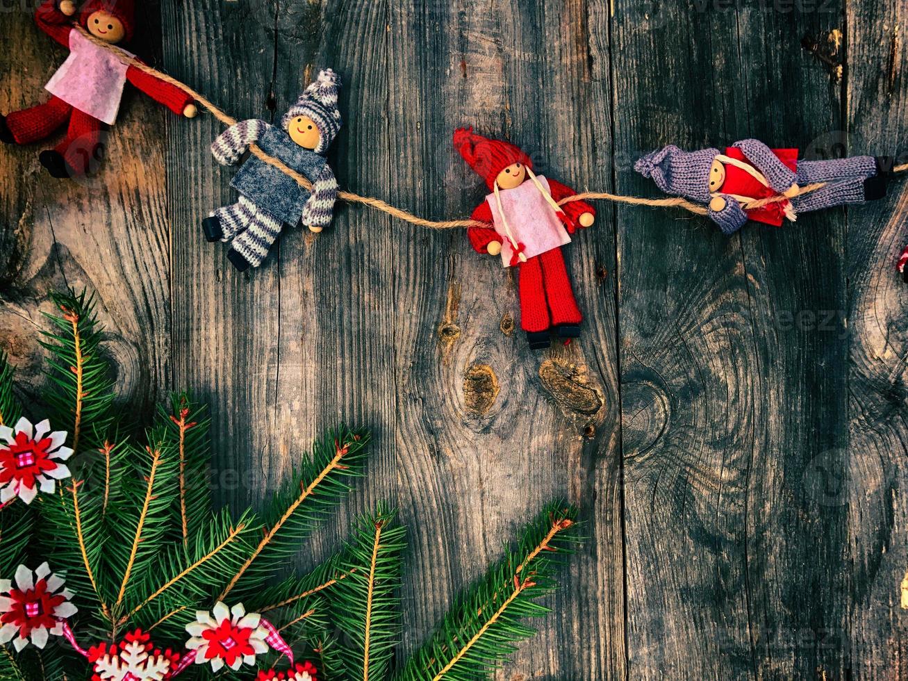 Textile Christmas toys on gray old wooden background photo