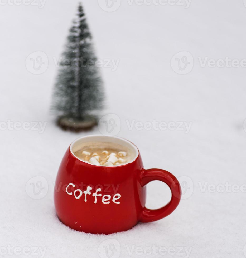 red ceramic mug with coffee and marshmallows photo