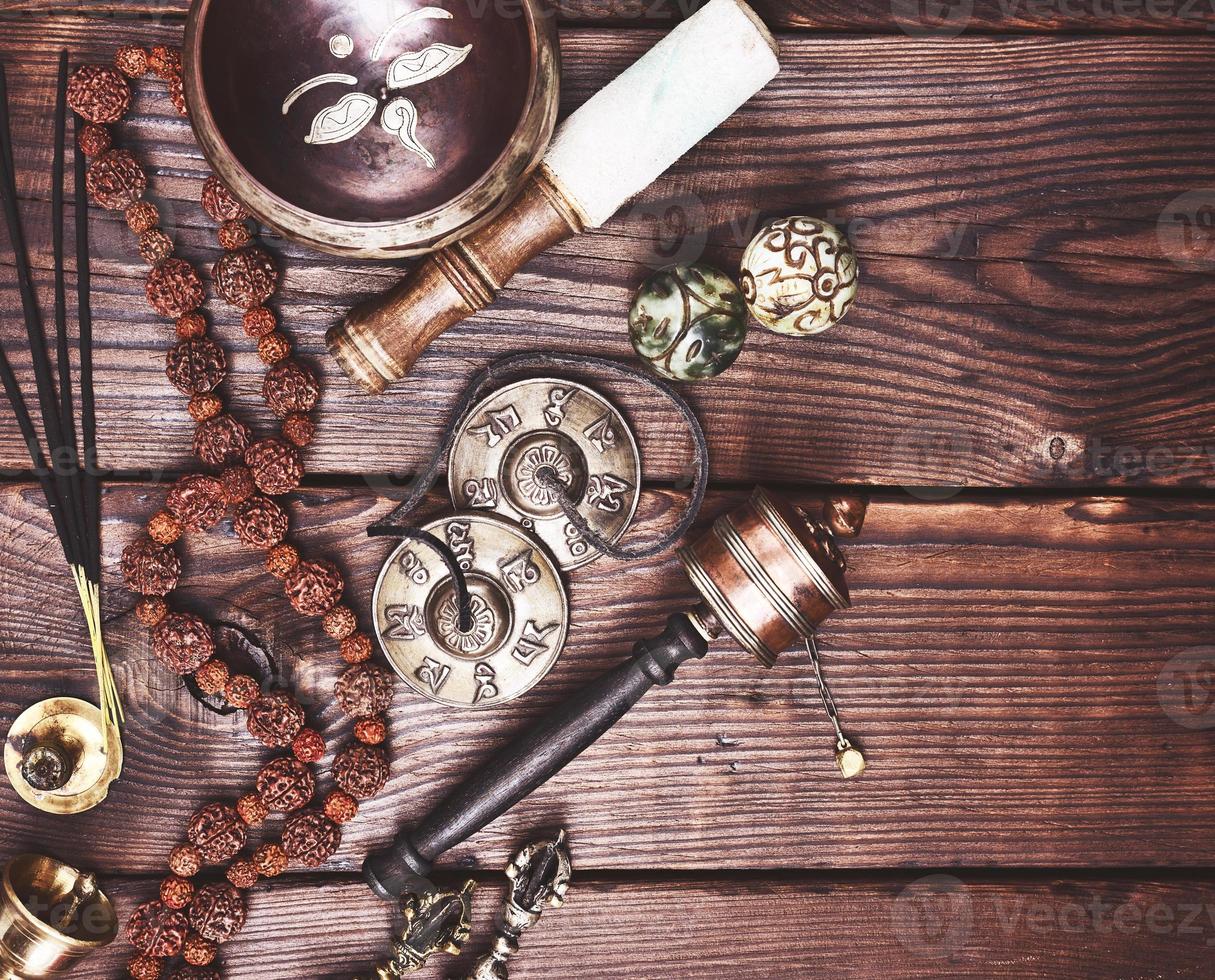 Tibetan singing bowl and other religious ritual instruments for meditation photo