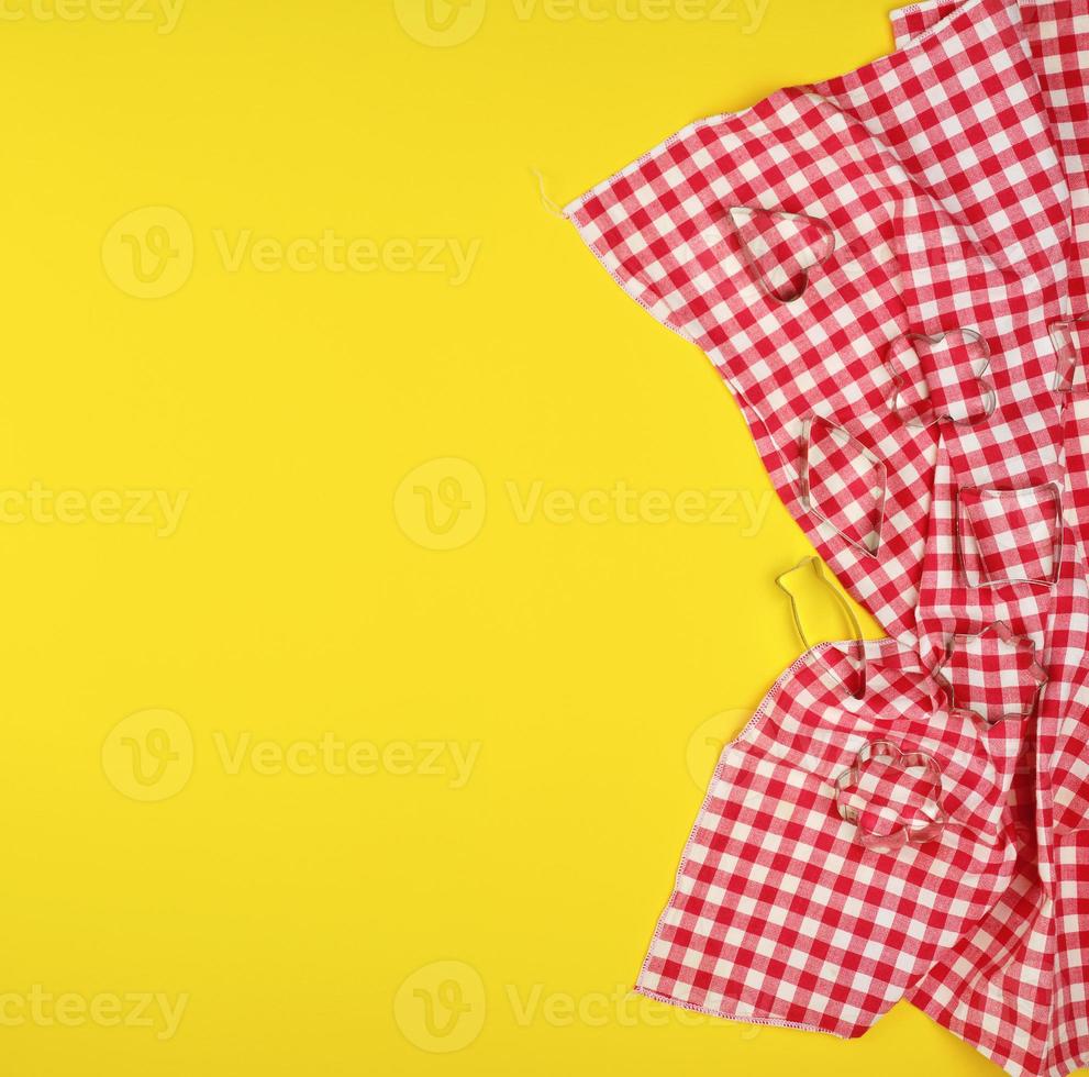white red checkered kitchen towel  and metal bakeware photo