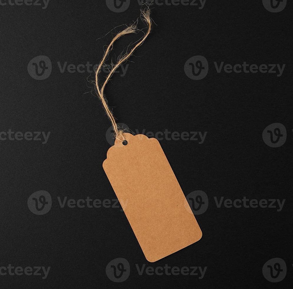 empty paper rectangular brown tag on a rope photo