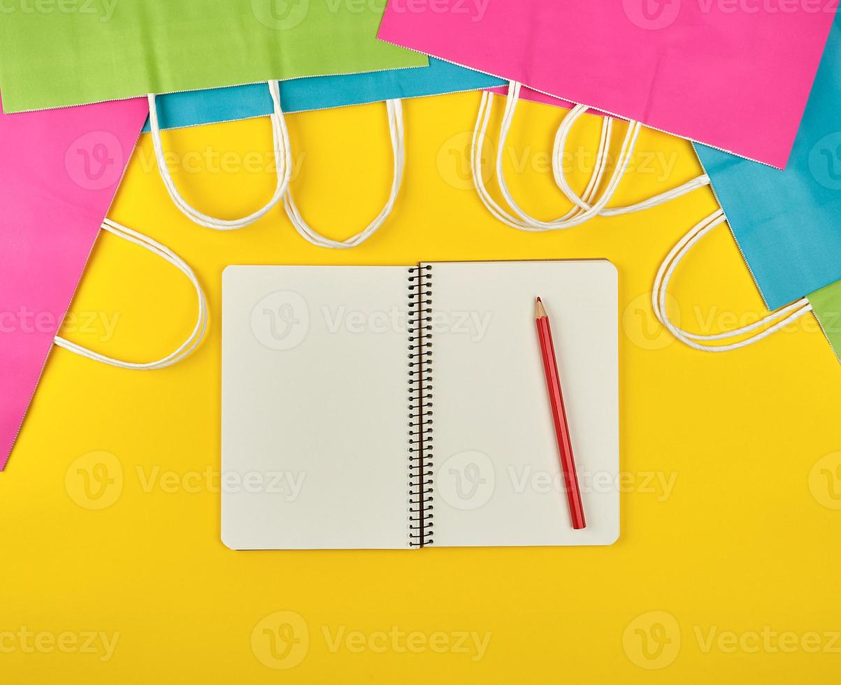 open notebook with blank white sheets photo