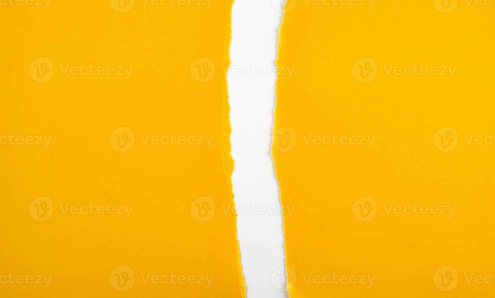 torn in half empty yellow sheet of paper photo