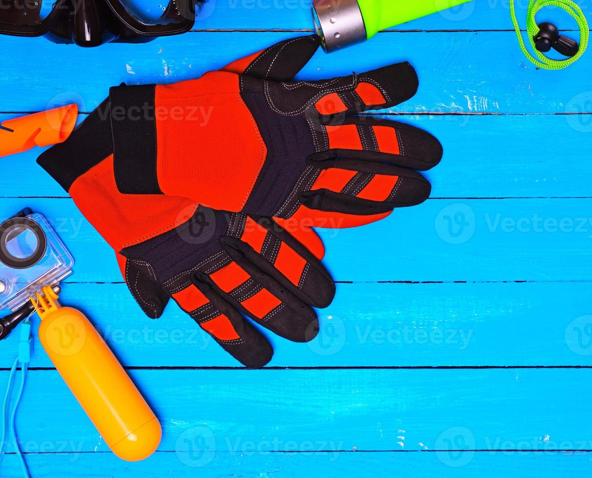Red gloves and diving items photo