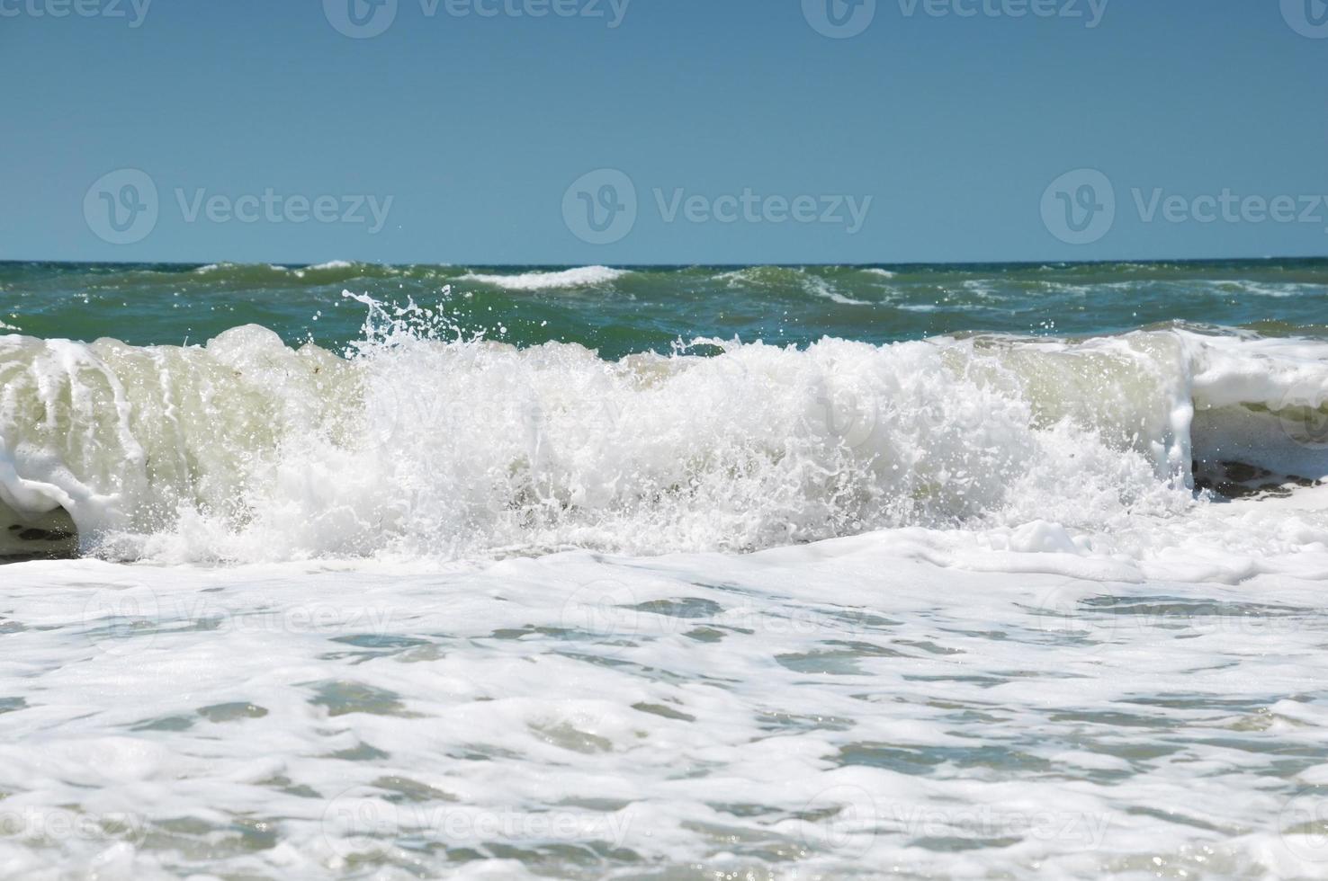 Foam on a sea wave photo
