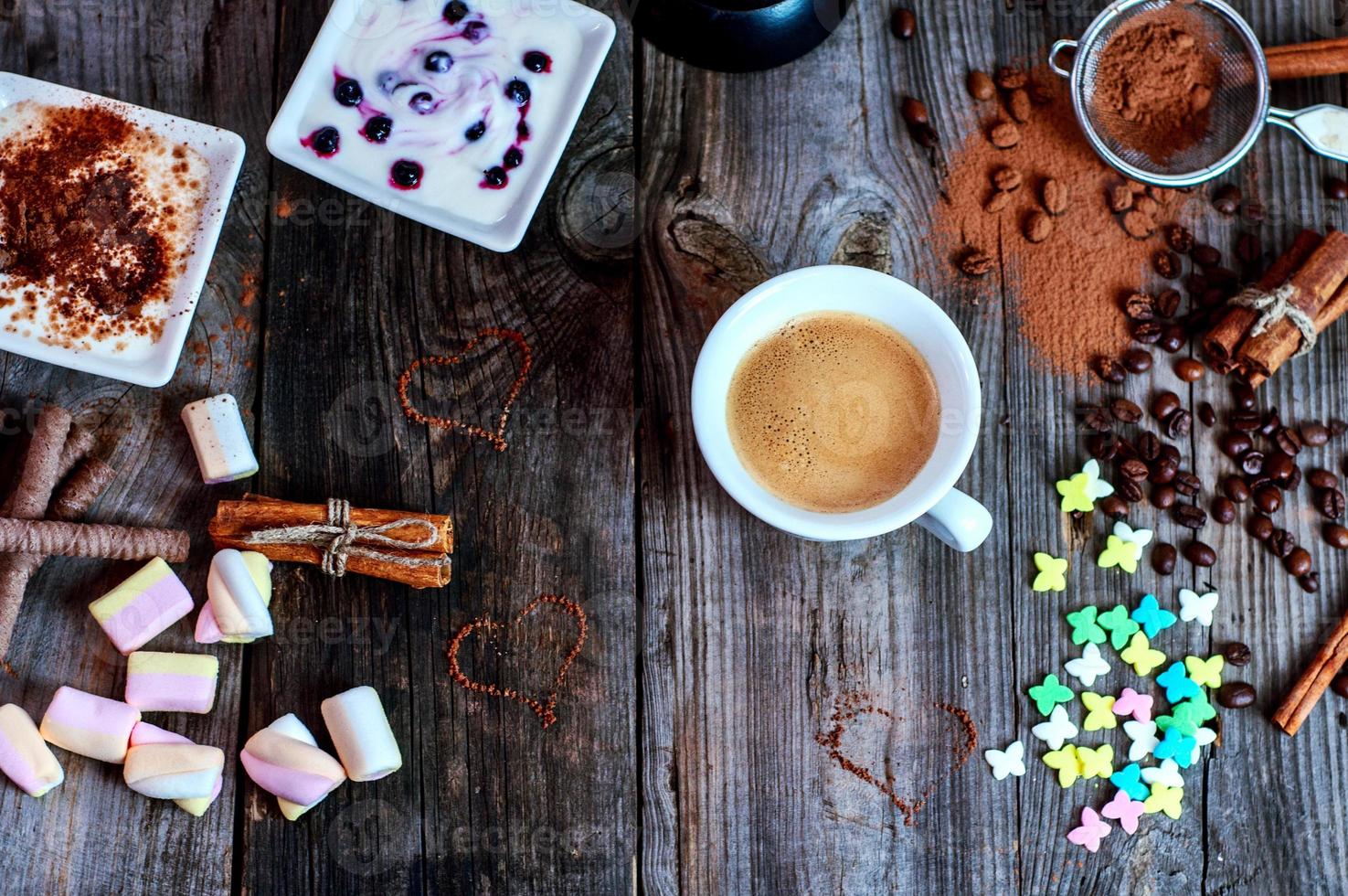 cup of black coffee with a dessert on the gray wooden surface photo