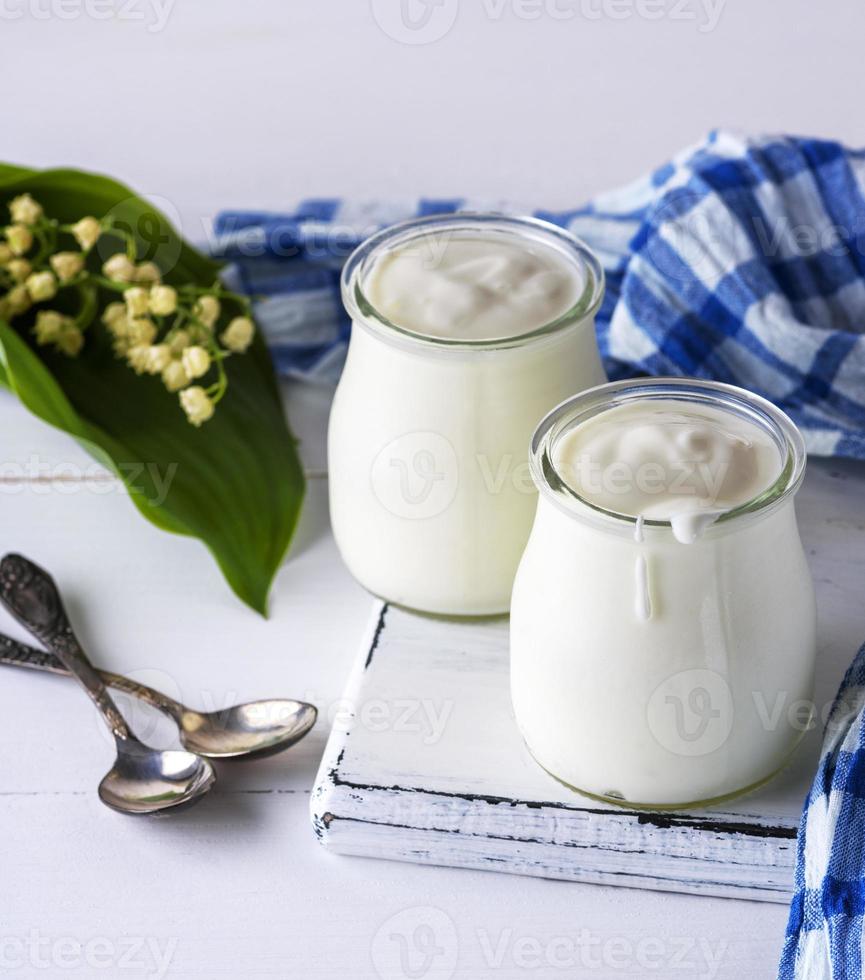 glass jars with homemade yogurt photo