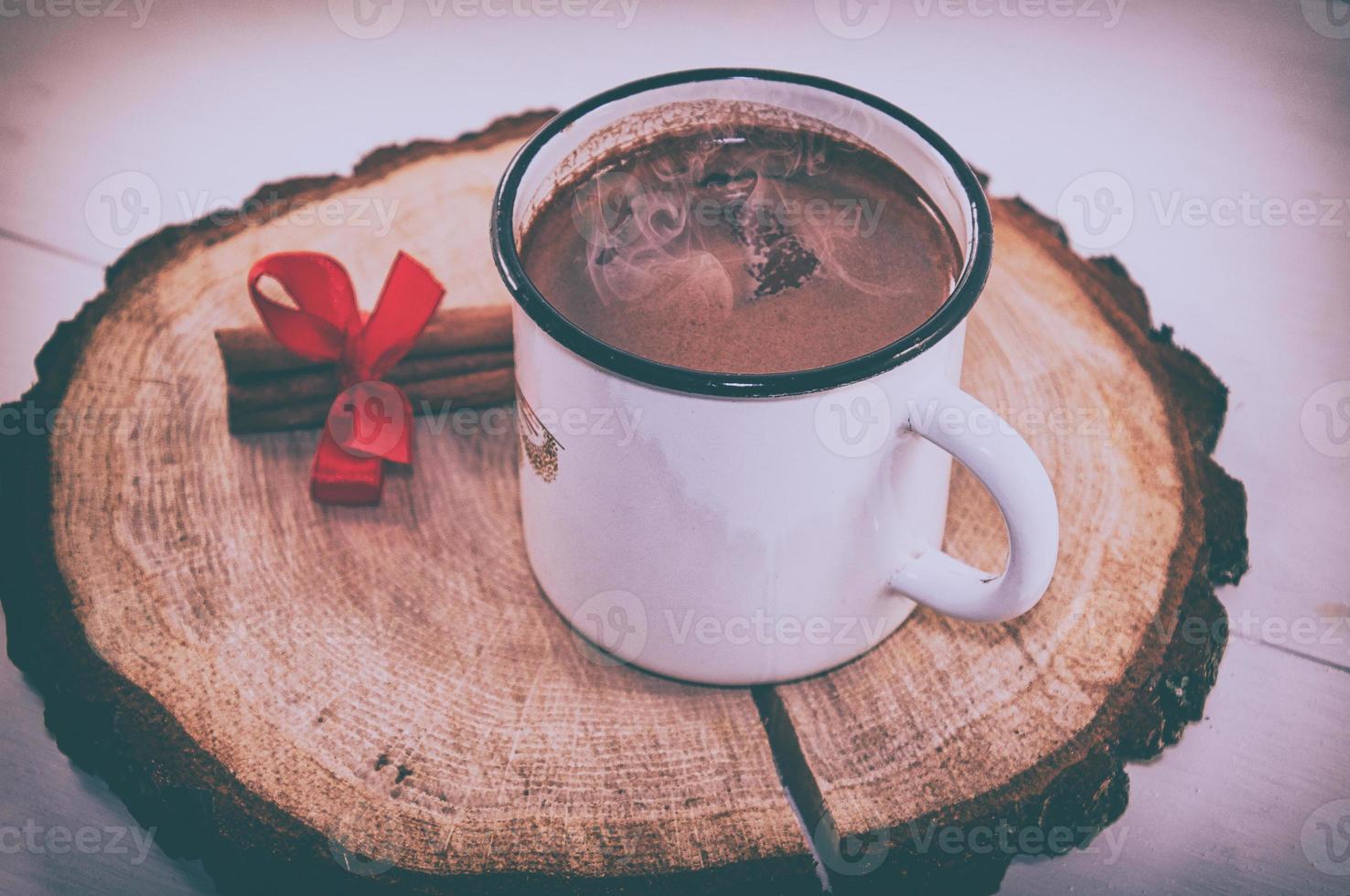 Hot cocoa drink in a white mug iron, vintage toning photo