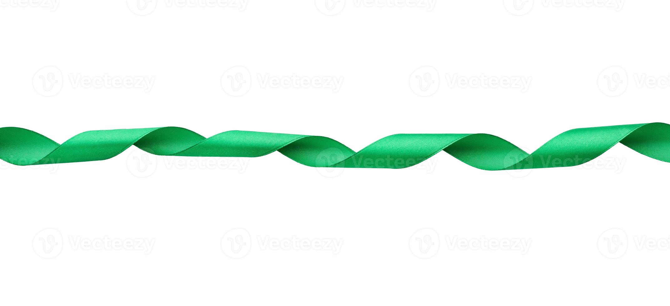 twisted silk green ribbon isolated on white background photo