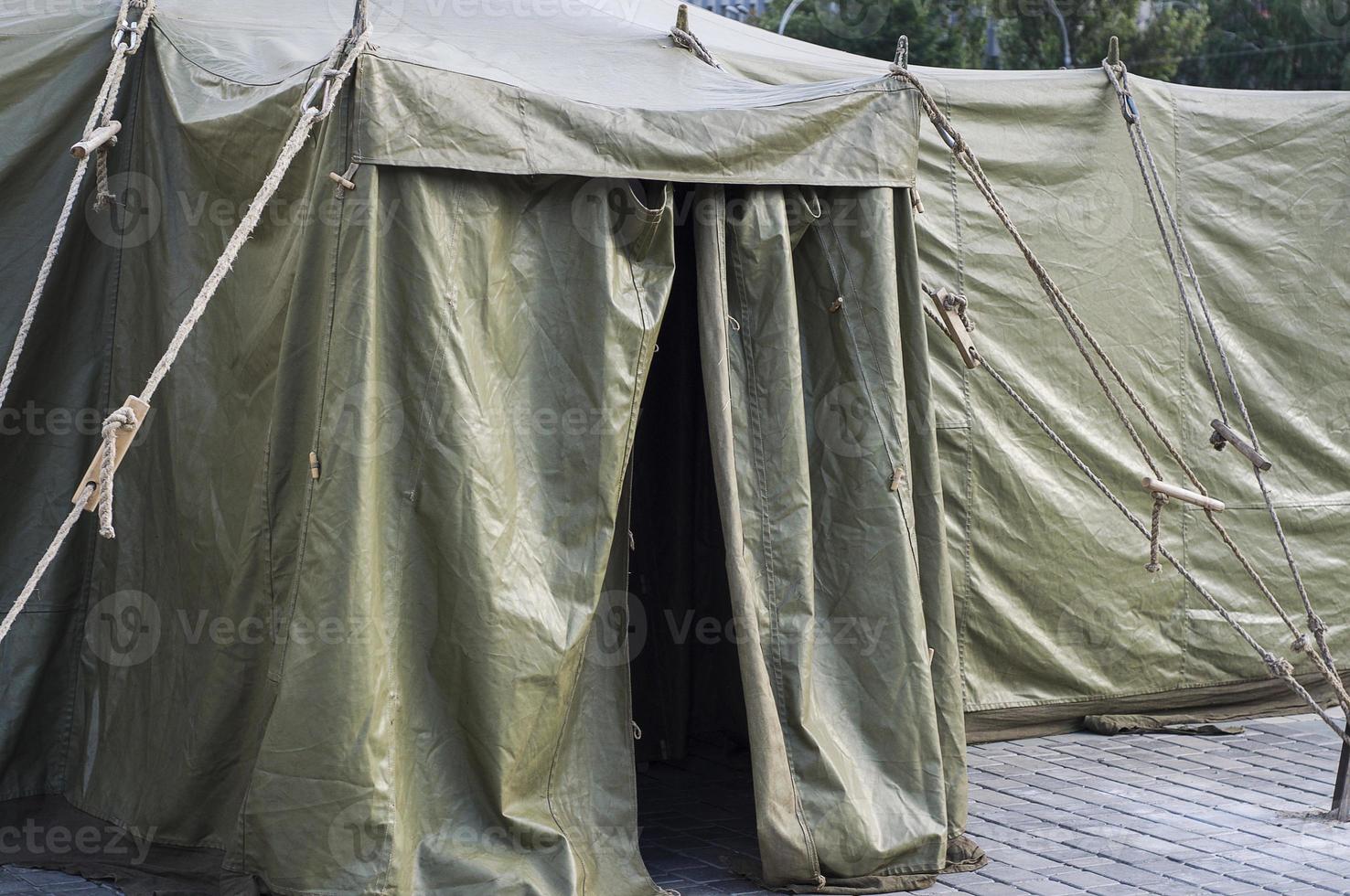 Entrance to the military tent, standing on the pavement photo