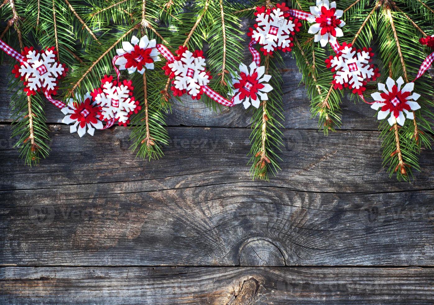 Christmas garland of spruce branches, and the felt snowflakes photo