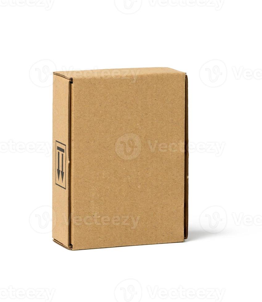 box made of brown corrugated cardboard isolated on white background. Eco-friendly packaging of goods photo