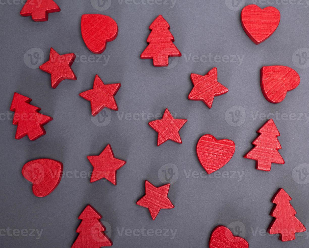 black background with red wooden figures photo