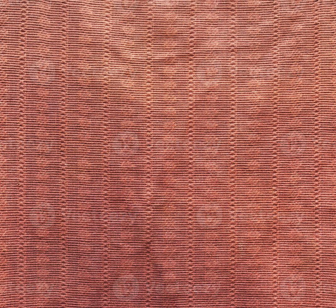 fragment of old brown textile carpet for floor photo