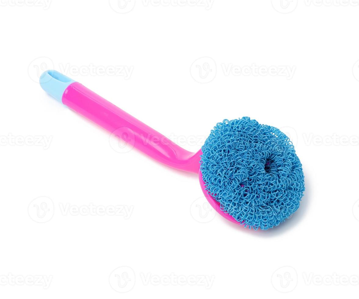 pink plastic brush with handle for cleaning isolated on white background photo