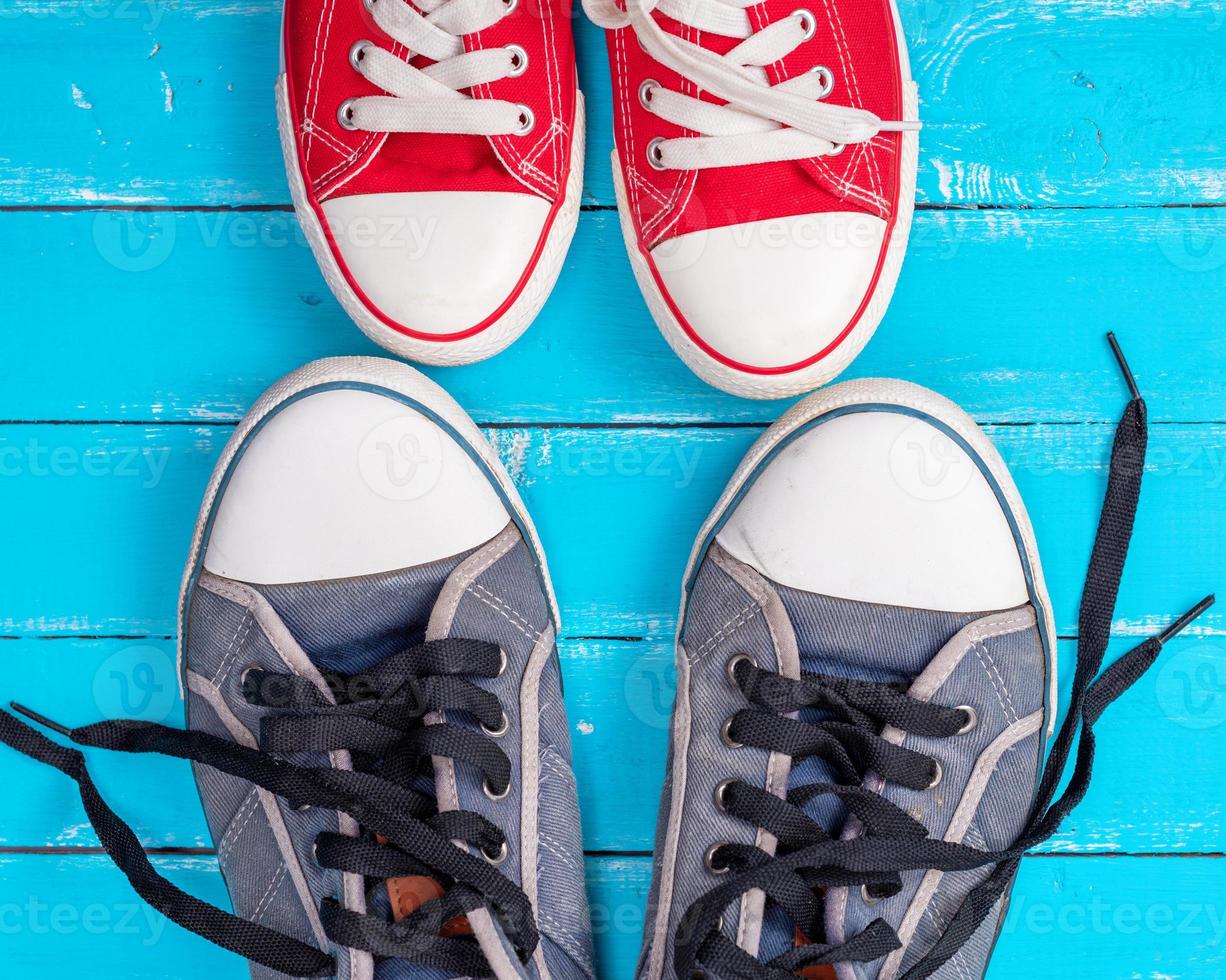 two pairs of old textile sneakers photo