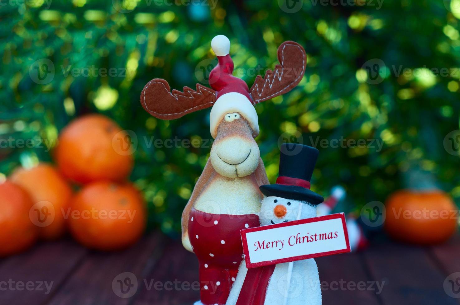 Figures Christmas elk and snowman with a sign photo