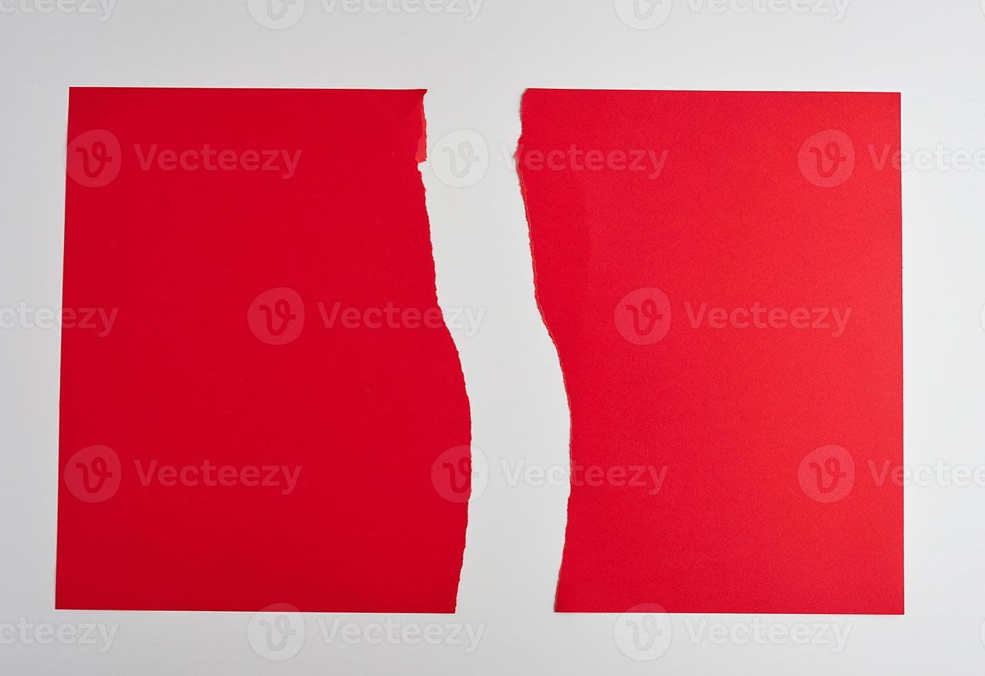 torn in half empty red sheet of paper on white background photo