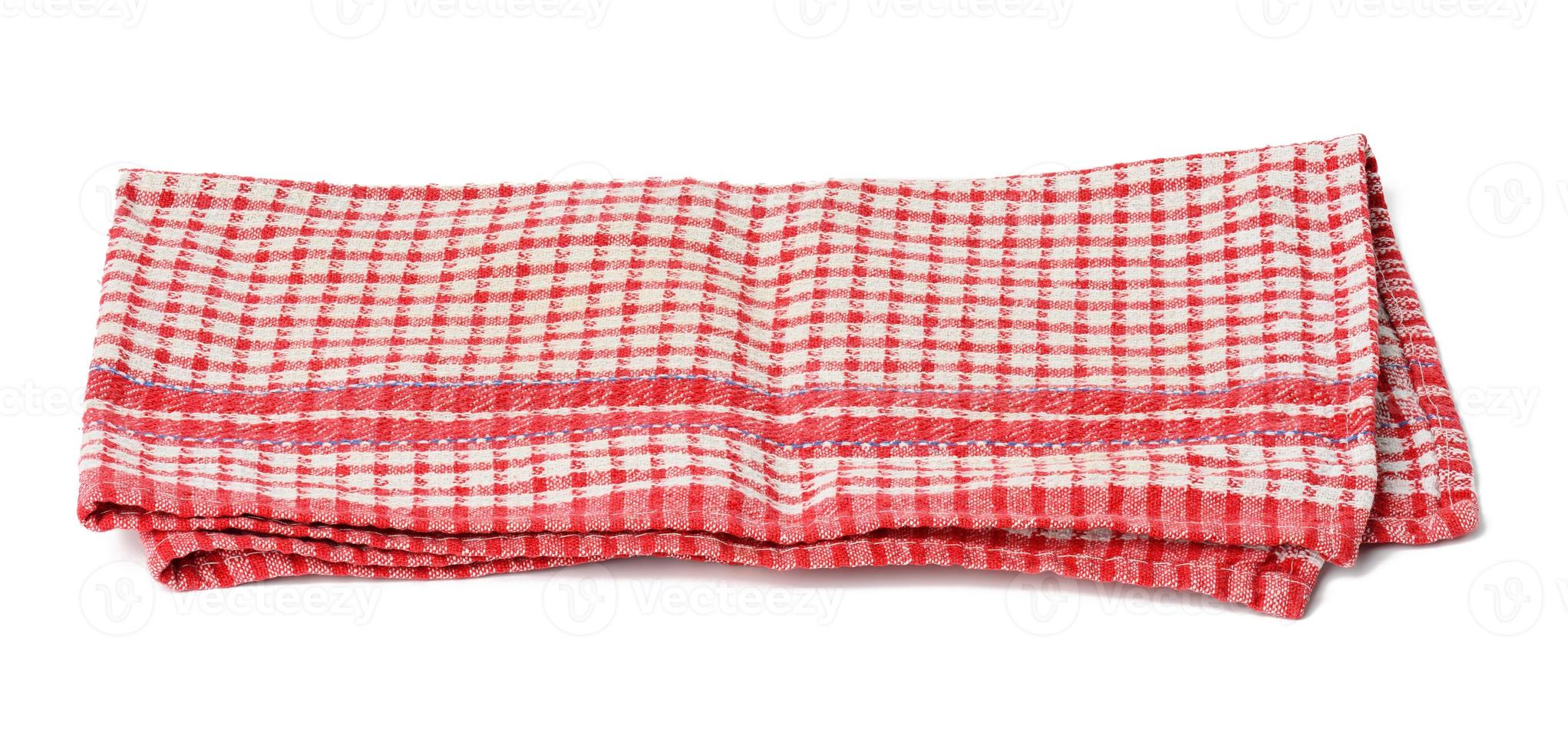 folded cotton red white checkered napkin on a white background photo