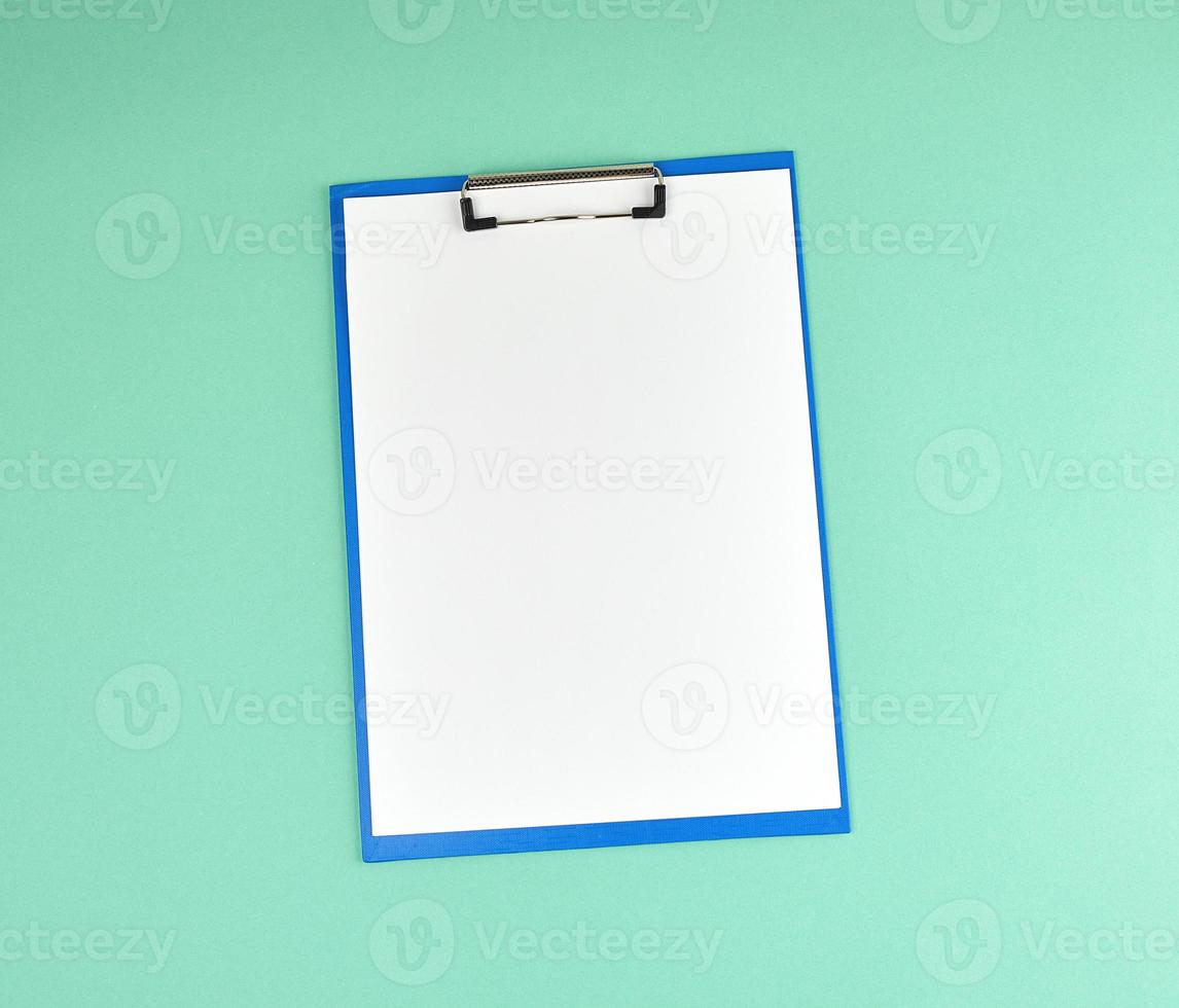 blue holder with clean white sheets on a green background photo
