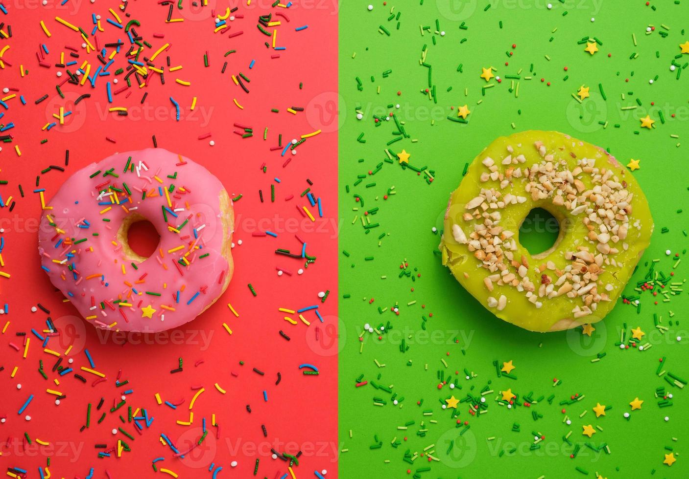 round different donuts with sprinkles on a bright multi-colored background photo