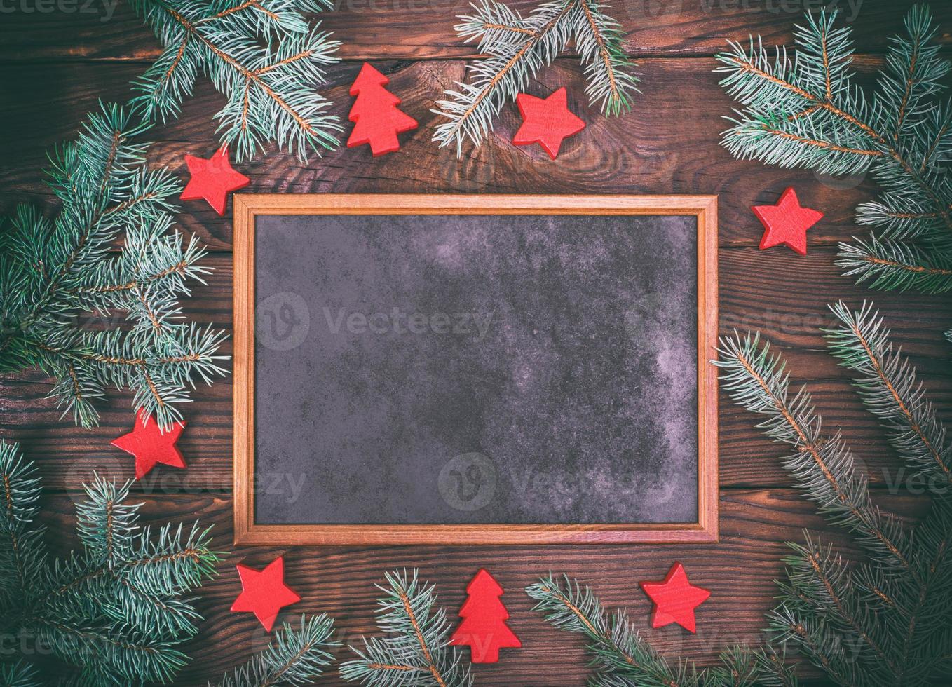 empty black frame on a brown wooden background photo