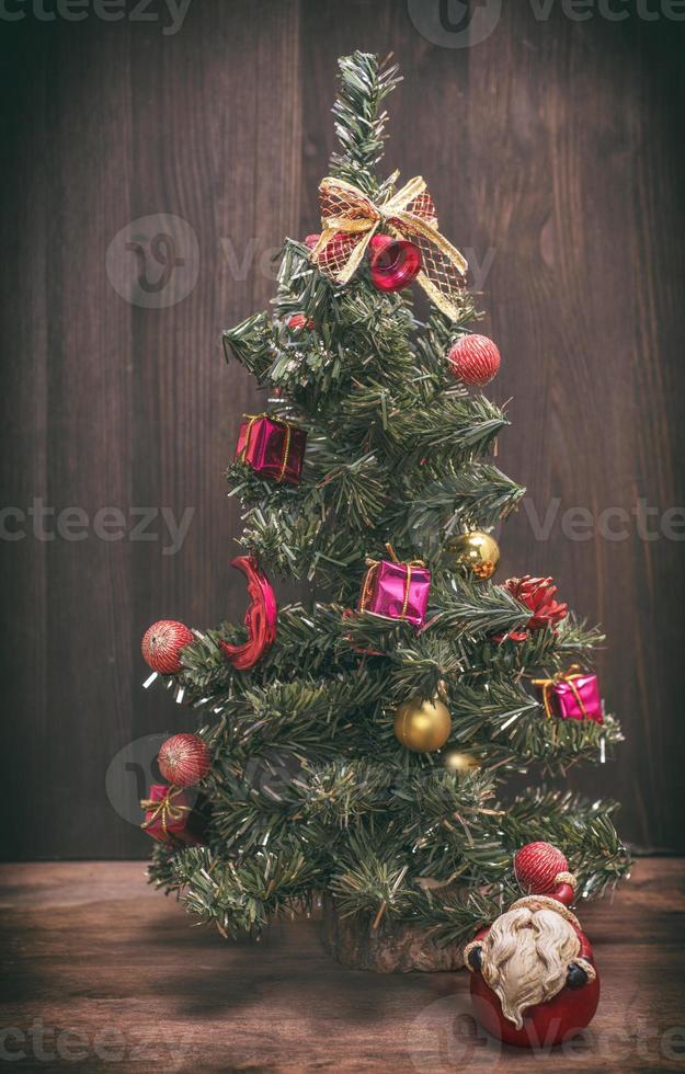 christmas tree on a wooden background photo