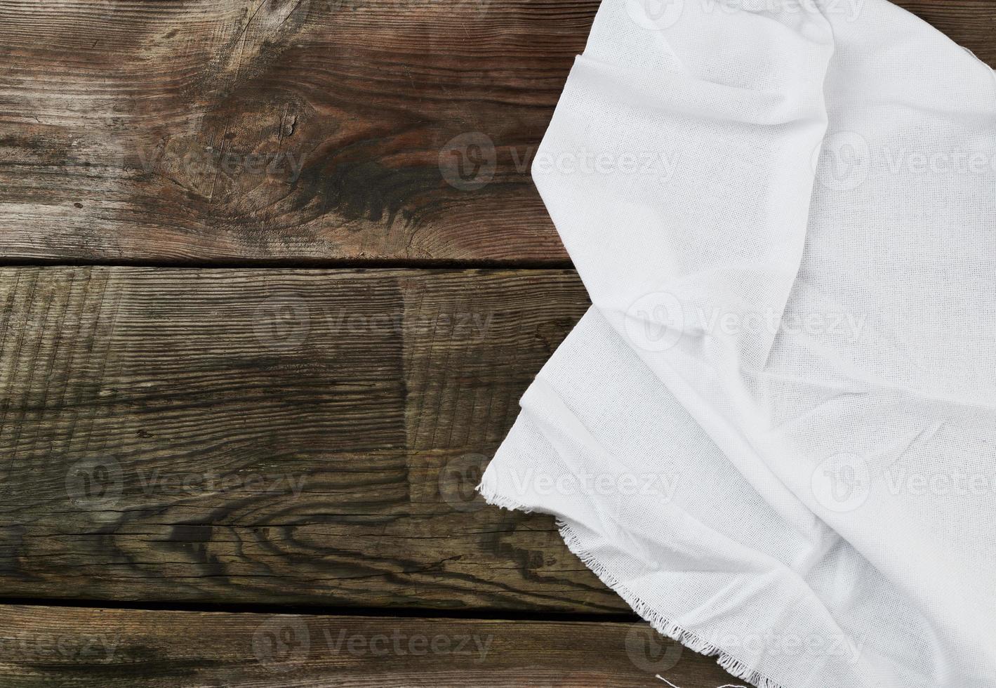 white kitchen textile towel folded on a gray wooden table from old boards photo