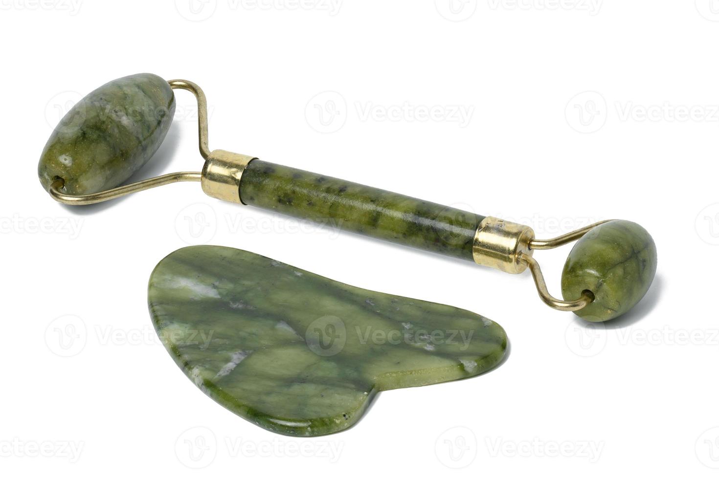 Jade facial massager, an item for cosmetic procedures on a white isolated background photo