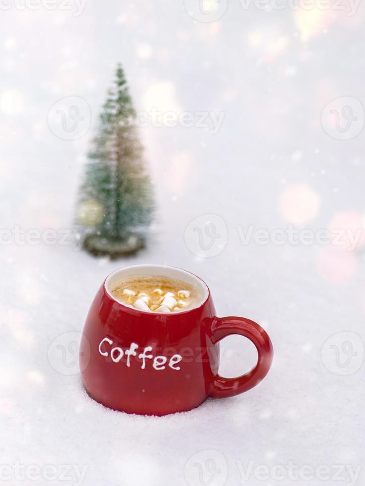 red ceramic mug with coffee and marshmallows photo