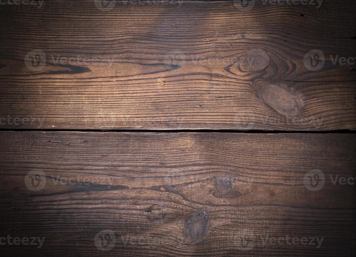 brown wooden background of old boards with swirls photo