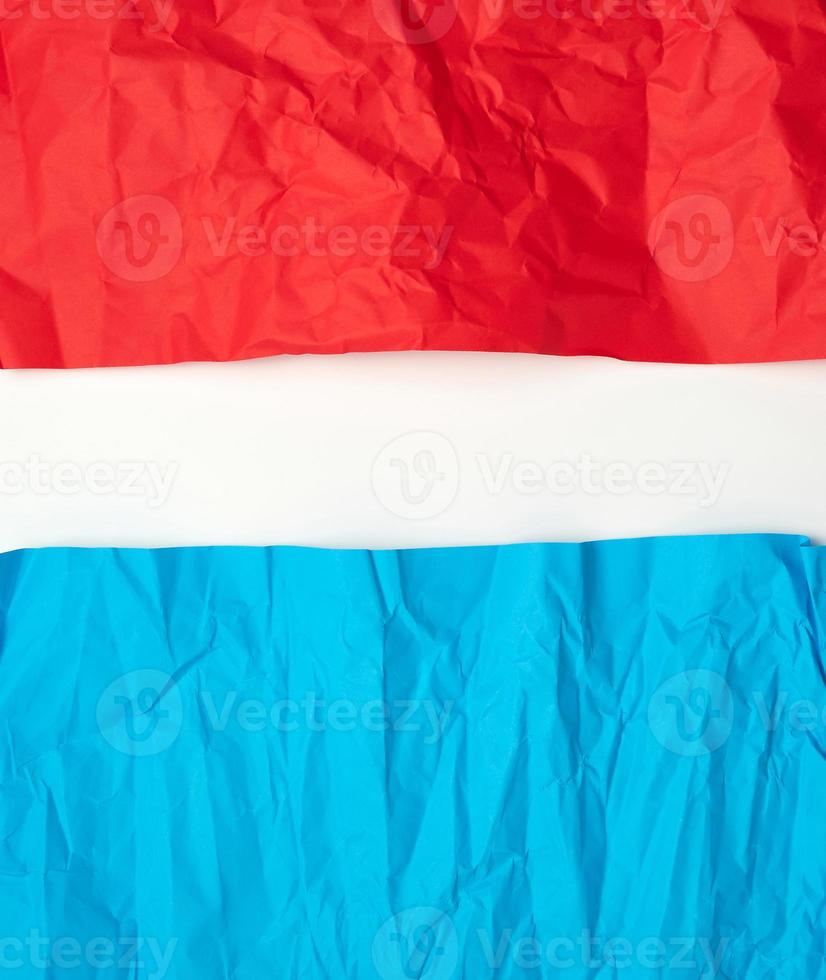 crumpled red and blue on paper on a white background photo
