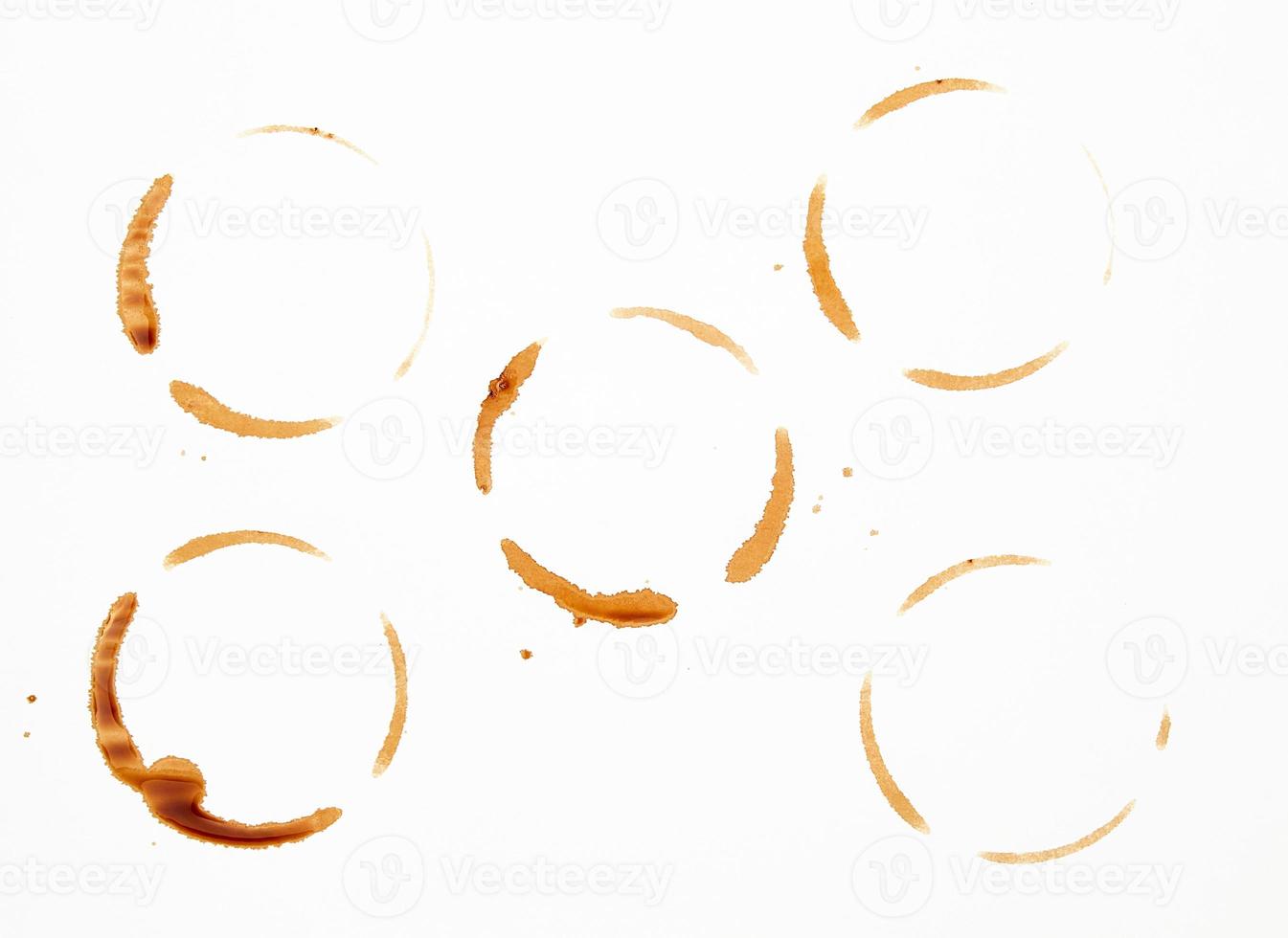 lot of round imprint from a coffee cup on a white paper background photo