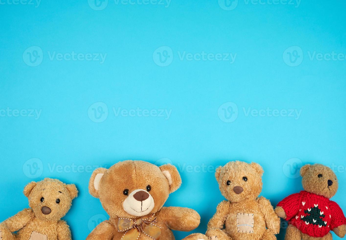 four teddy bears on a blue background, friendship concept photo