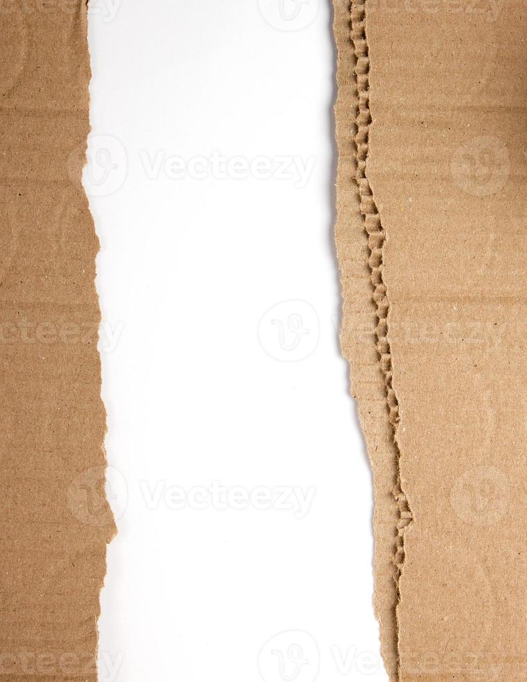 brown paper from the box, torn edge on a white background photo