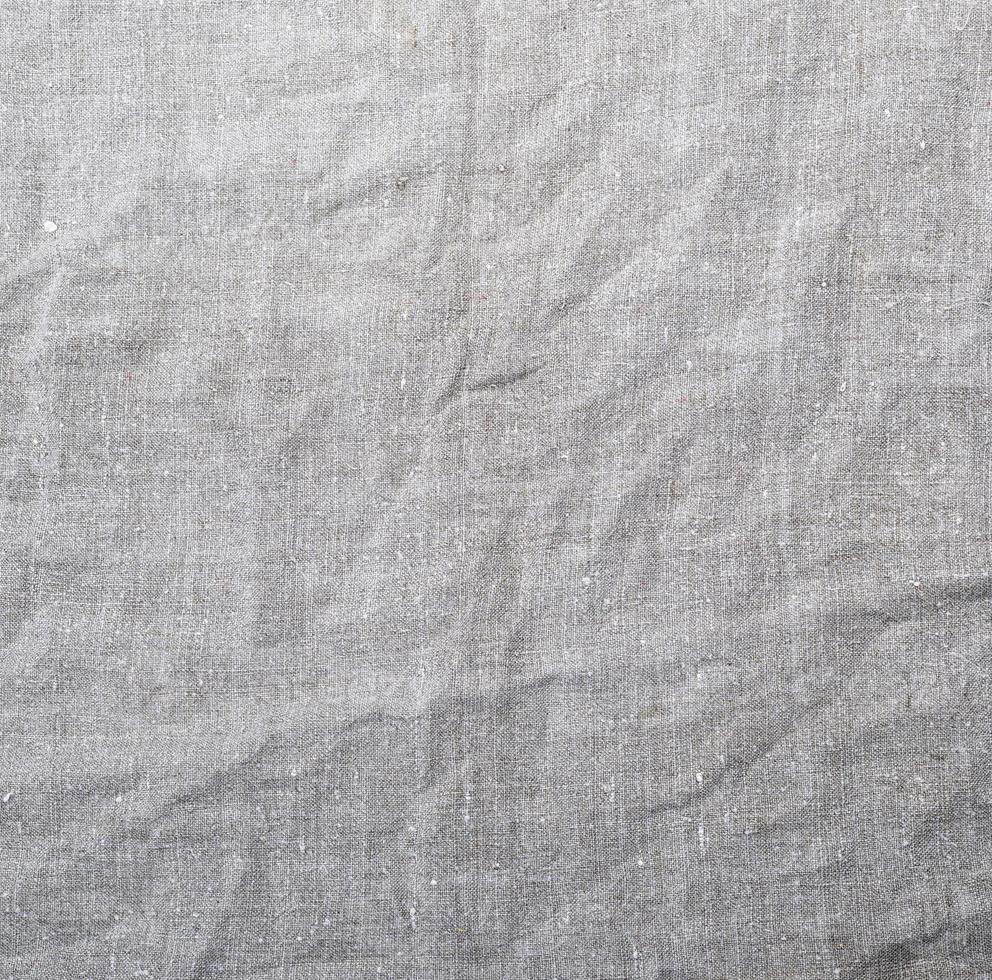 fragment of gray linen fabric, crumpled texture photo